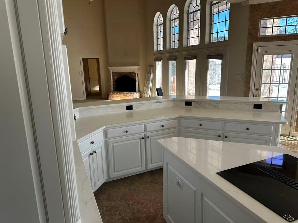 6512 Mesa Ridge Court Fort Worth, TX 76137 - Photo 11 of 24 a spacious bathroom with a double vanity sink a mirror and a bathtub