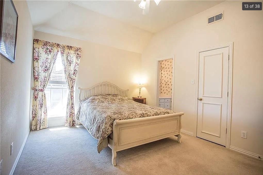 6512 Mesa Ridge Court Fort Worth, TX 76137 - Photo 16 of 24 a bedroom with a bed and a window