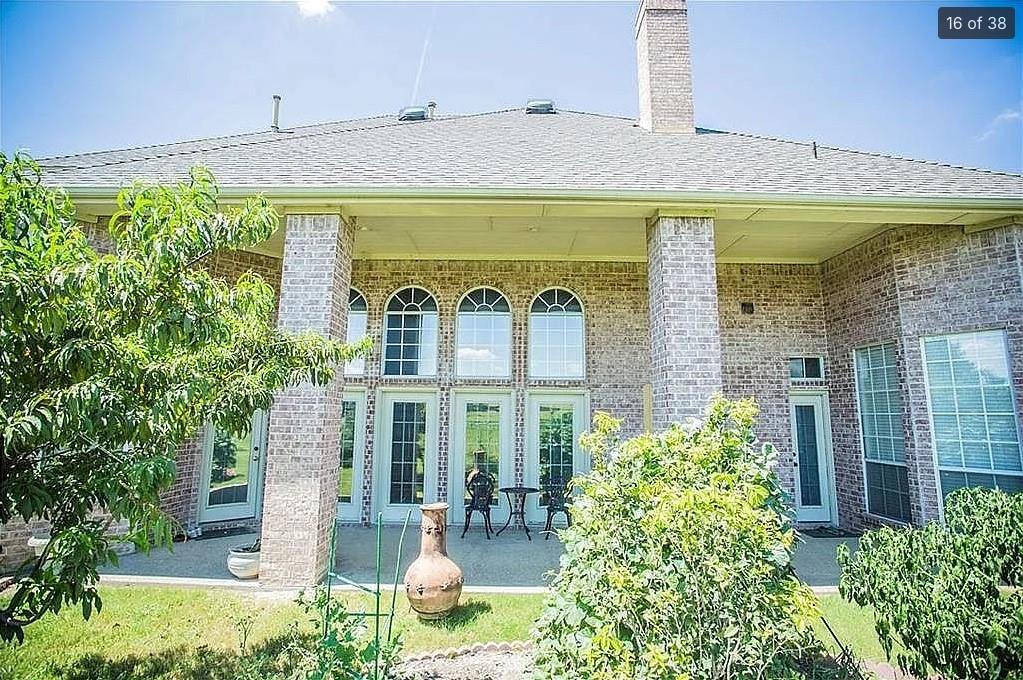 6512 Mesa Ridge Court Fort Worth, TX 76137 - Photo 21 of 24 a front view of a building with garden