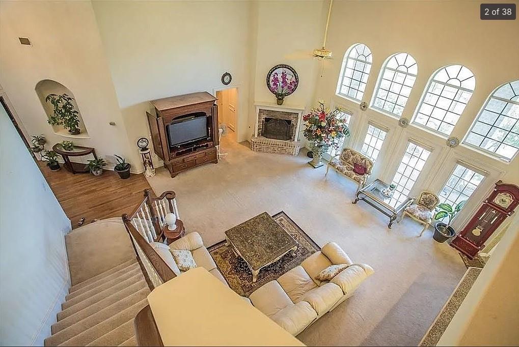 6512 Mesa Ridge Court Fort Worth, TX 76137 - Photo 3 of 24 a living room with furniture and a fireplace