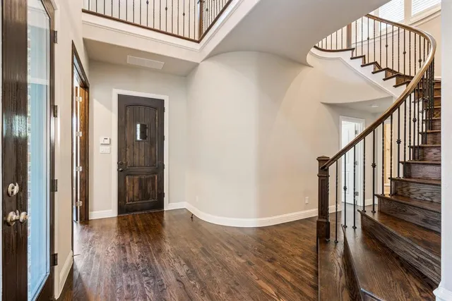 a view of entryway with wooden floor