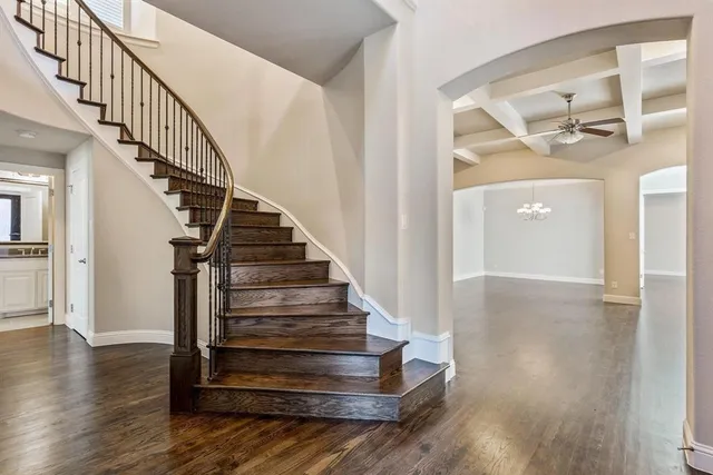 a view of entryway and hall with wooden floor
