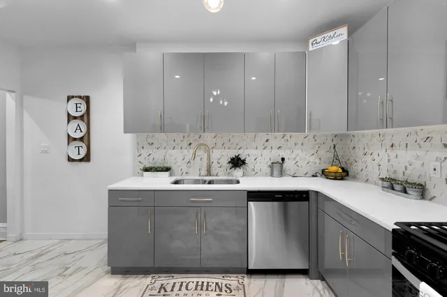 a kitchen with a sink and cabinets