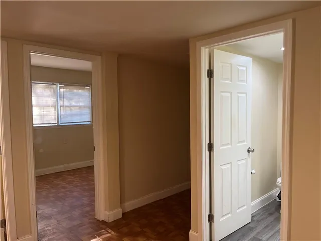 a view of an empty room with a closet