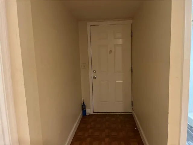 a view of hallway with closet