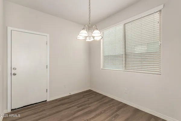a view of a chandelier in an empty room