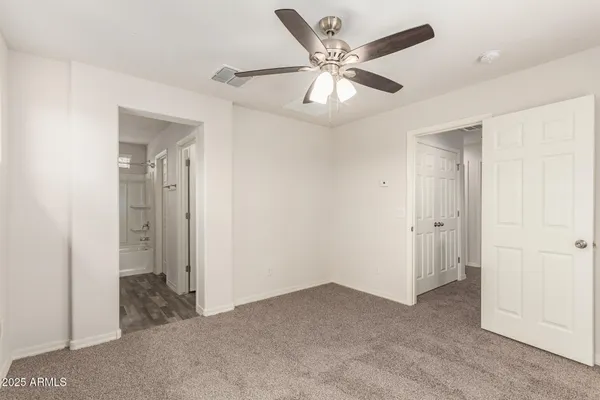 a view of a livingroom with a ceiling fan
