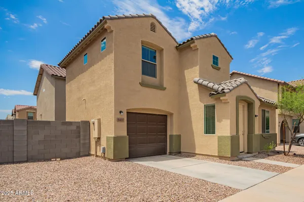 a front view of a house with a garage