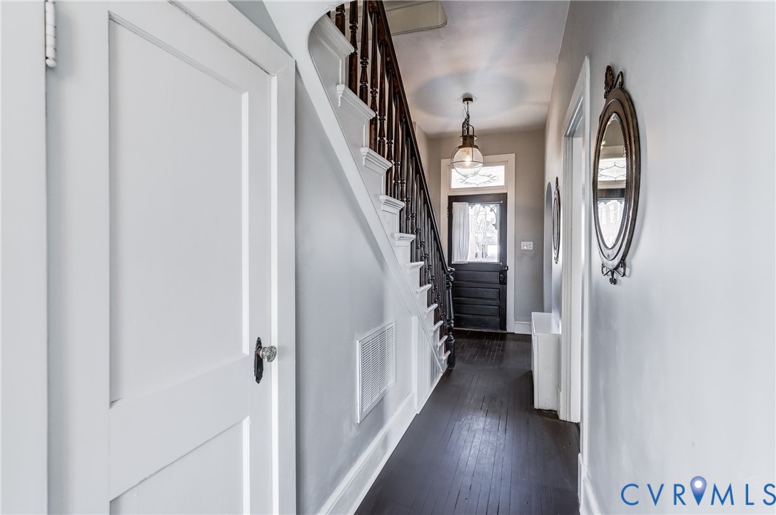 418 4th Street West Point, VA 23181 - Photo 6 of 36 a view of a hallway with wooden floor and staircase