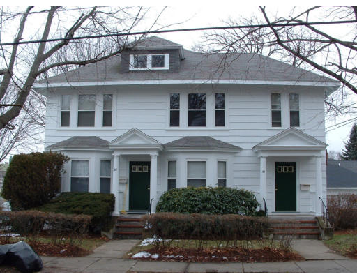 28-30 Crosby Road Newton, MA 02467 - Photo 1 of 1 a front view of a house with yard and parking