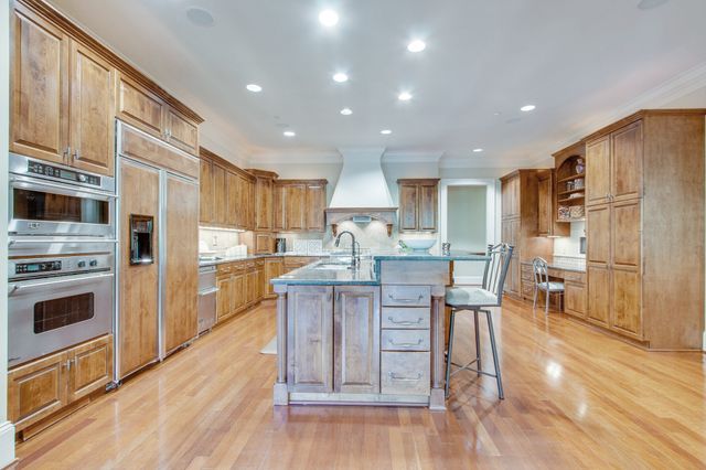 a outdoor space with lots of furniture and wooden floor