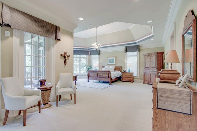a view of an empty room with cabinet and a window