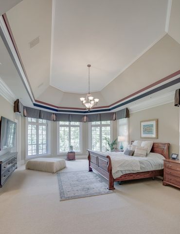 a kitchen with stainless steel appliances granite countertop a sink a stove and cabinets