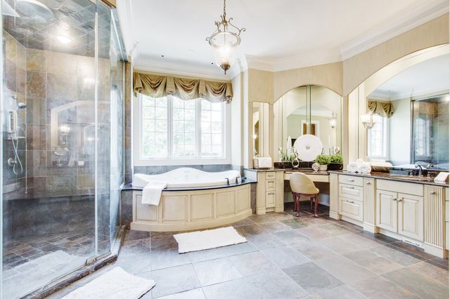 a living room with furniture and large windows