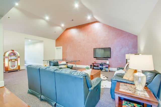 an aerial view of a house with outdoor space and street view