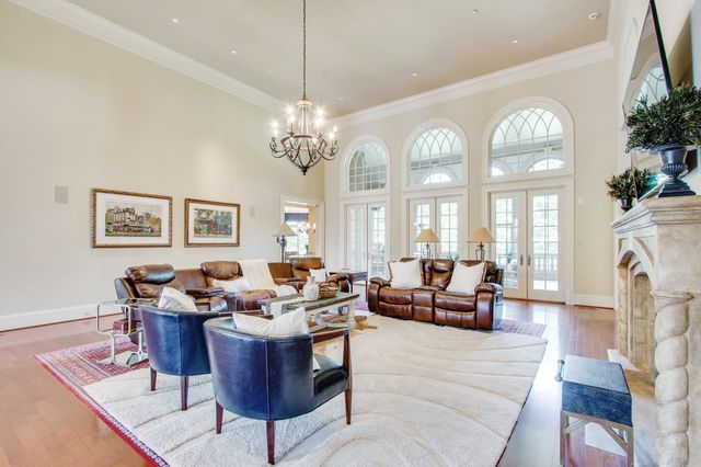 a large kitchen with stainless steel appliances granite countertop a large counter top and a stove top oven