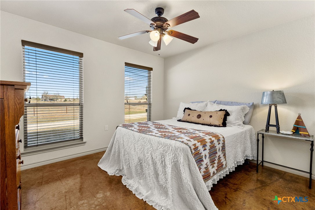 381 Schneider Road Seguin, TX 78155 - Photo 14 of 46 a bedroom with bed and window