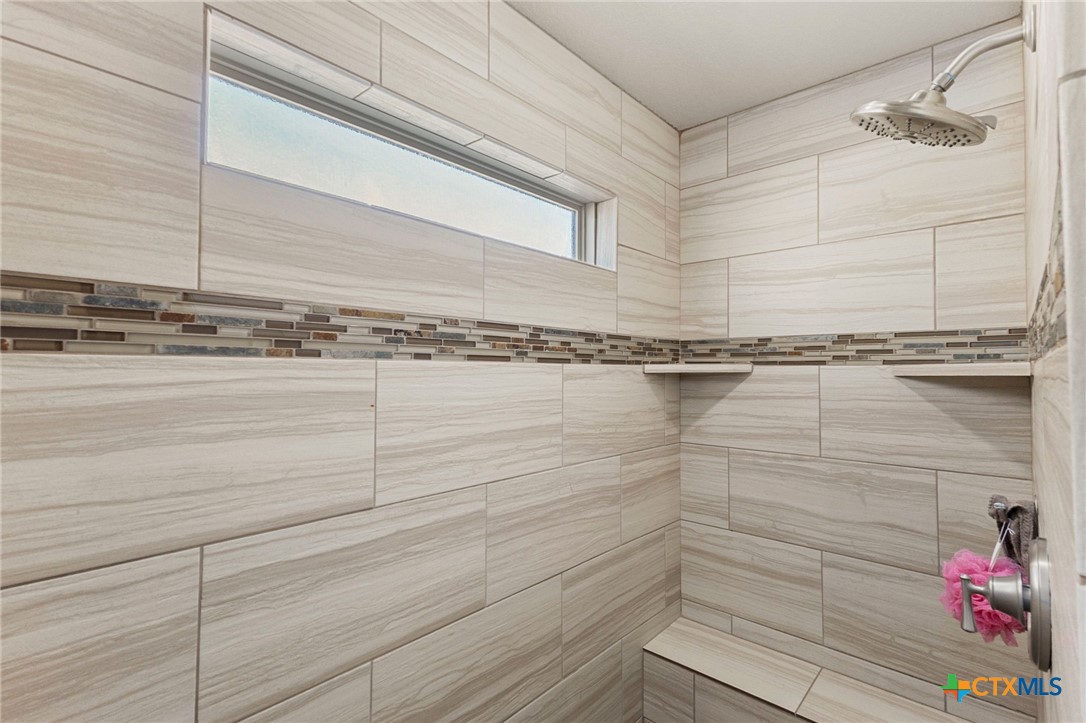 381 Schneider Road Seguin, TX 78155 - Photo 23 of 46 a bathroom with a shower