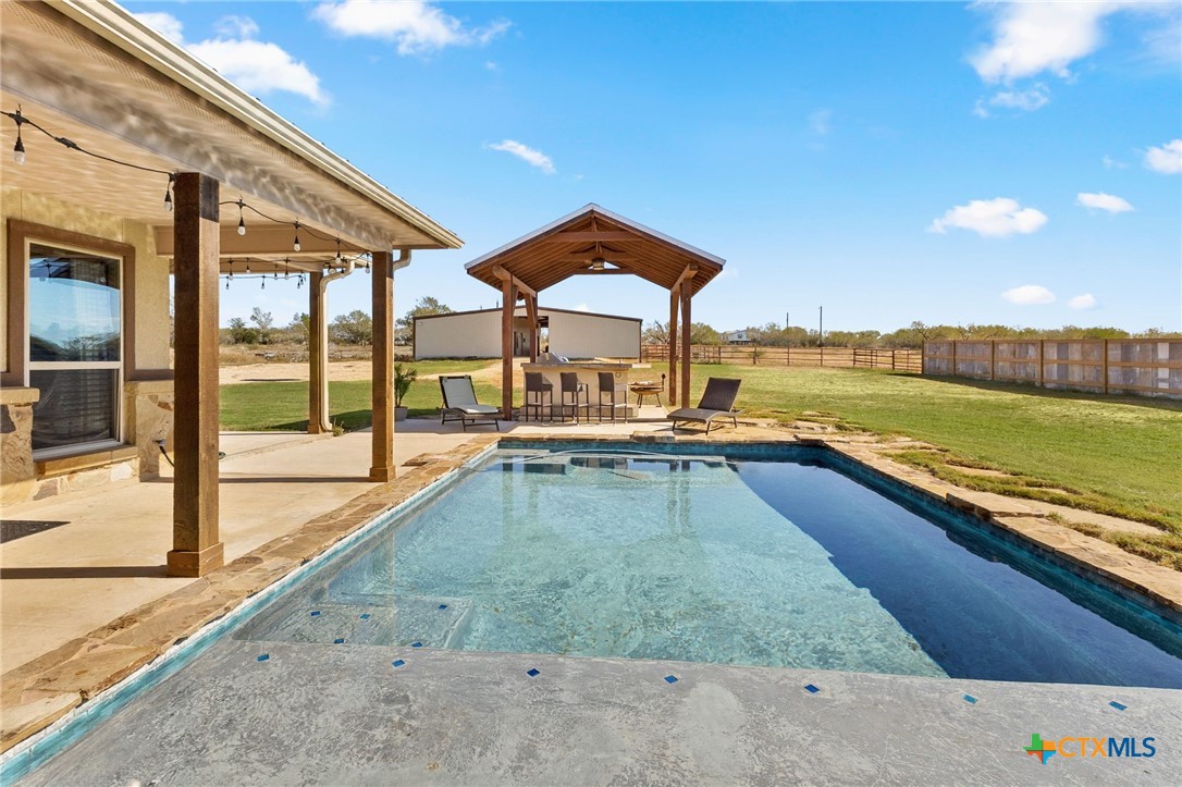 381 Schneider Road Seguin, TX 78155 - Photo 25 of 46 a view of a swimming pool and an outdoor space