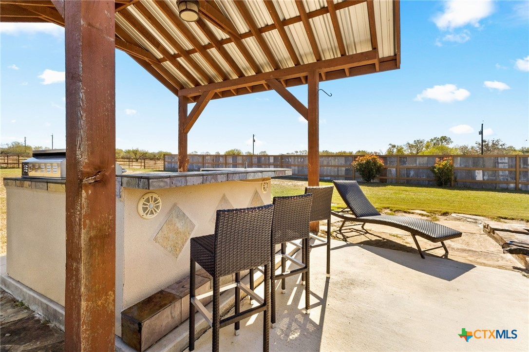 381 Schneider Road Seguin, TX 78155 - Photo 29 of 46 a view of swimming pool with outdoor seating and city view