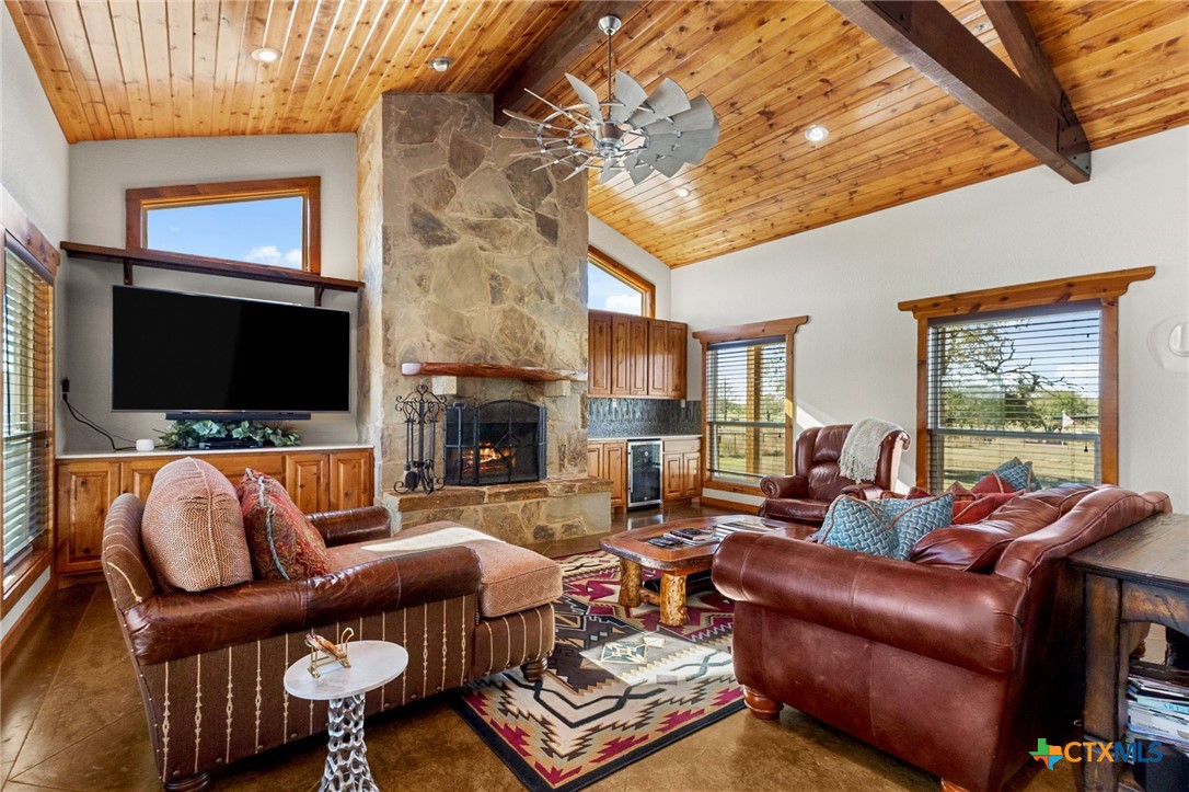 381 Schneider Road Seguin, TX 78155 - Photo 3 of 46 a living room with fireplace furniture and a flat screen tv