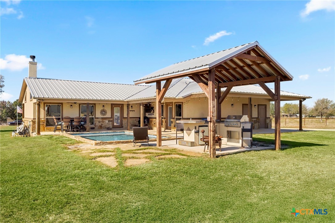 381 Schneider Road Seguin, TX 78155 - Photo 31 of 46 a view of a house with backyard porch and sitting area