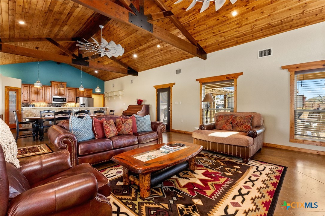 381 Schneider Road Seguin, TX 78155 - Photo 6 of 46 a outdoor living space with furniture and a fireplace