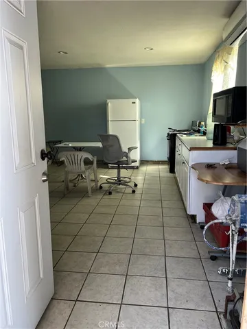 a living room with furniture and natural light