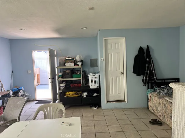 a bedroom with a bed and cabinets