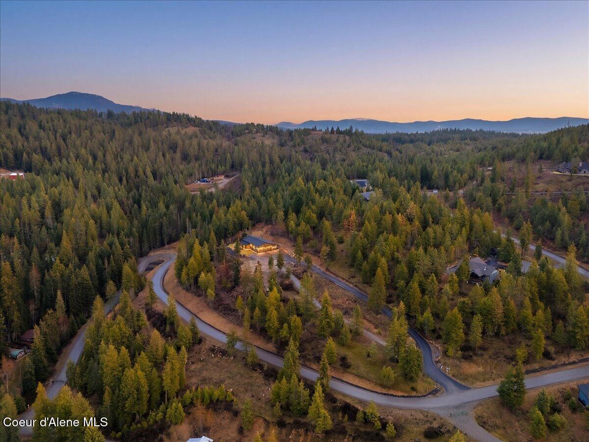 17045 West Cade Road Hauser, ID 83854 - Photo 2 of 83 02-Twilight Aerial Front of Home