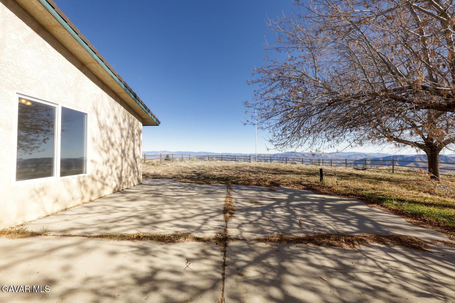 26801 Cabriolet Court Tehachapi, CA 93561 - Photo 37 of 60 a view of a yard with wooden fence