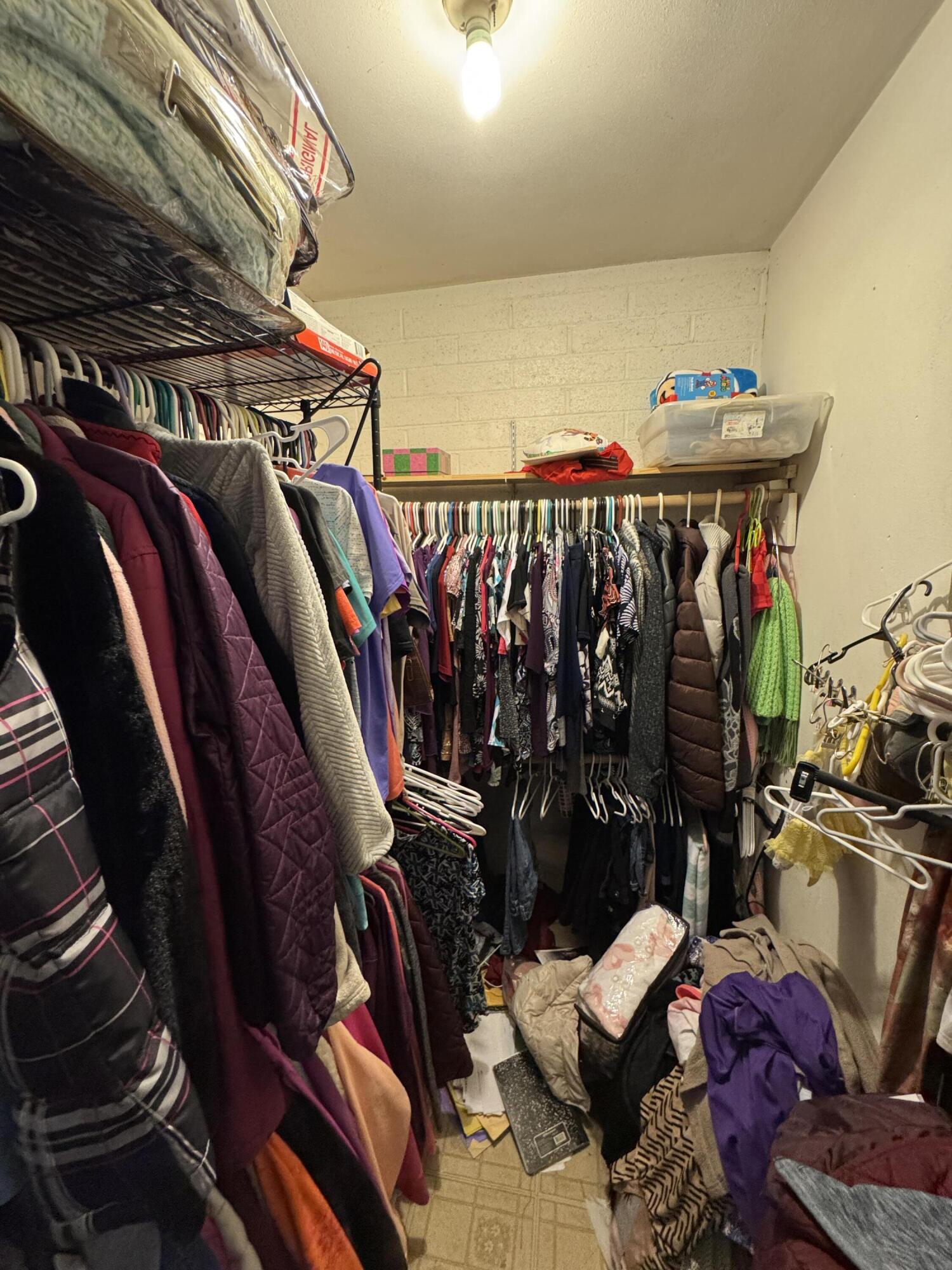 704 North Floral Street Visalia, CA 93291 - Photo 18 of 51 a view of walk in closet with clothes and shoes