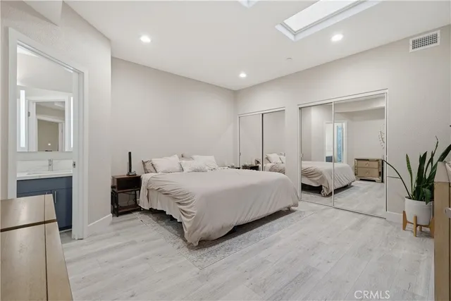 a bedroom with bed and a couch