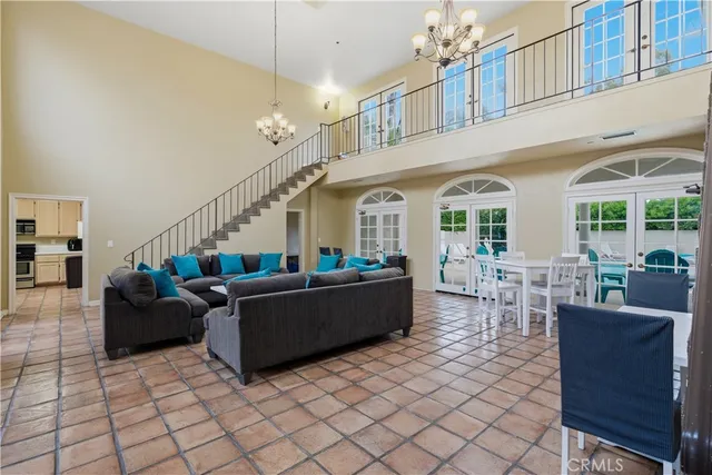 a kitchen with stainless steel appliances granite countertop a refrigerator sink and stove