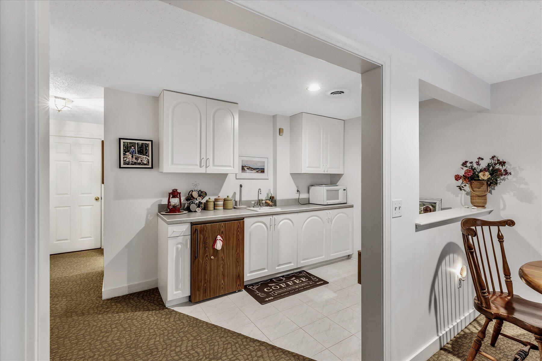 42 Wood Road Mashpee, MA 02649 - Photo 41 of 50 a kitchen with stainless steel appliances granite countertop a refrigerator and a stove