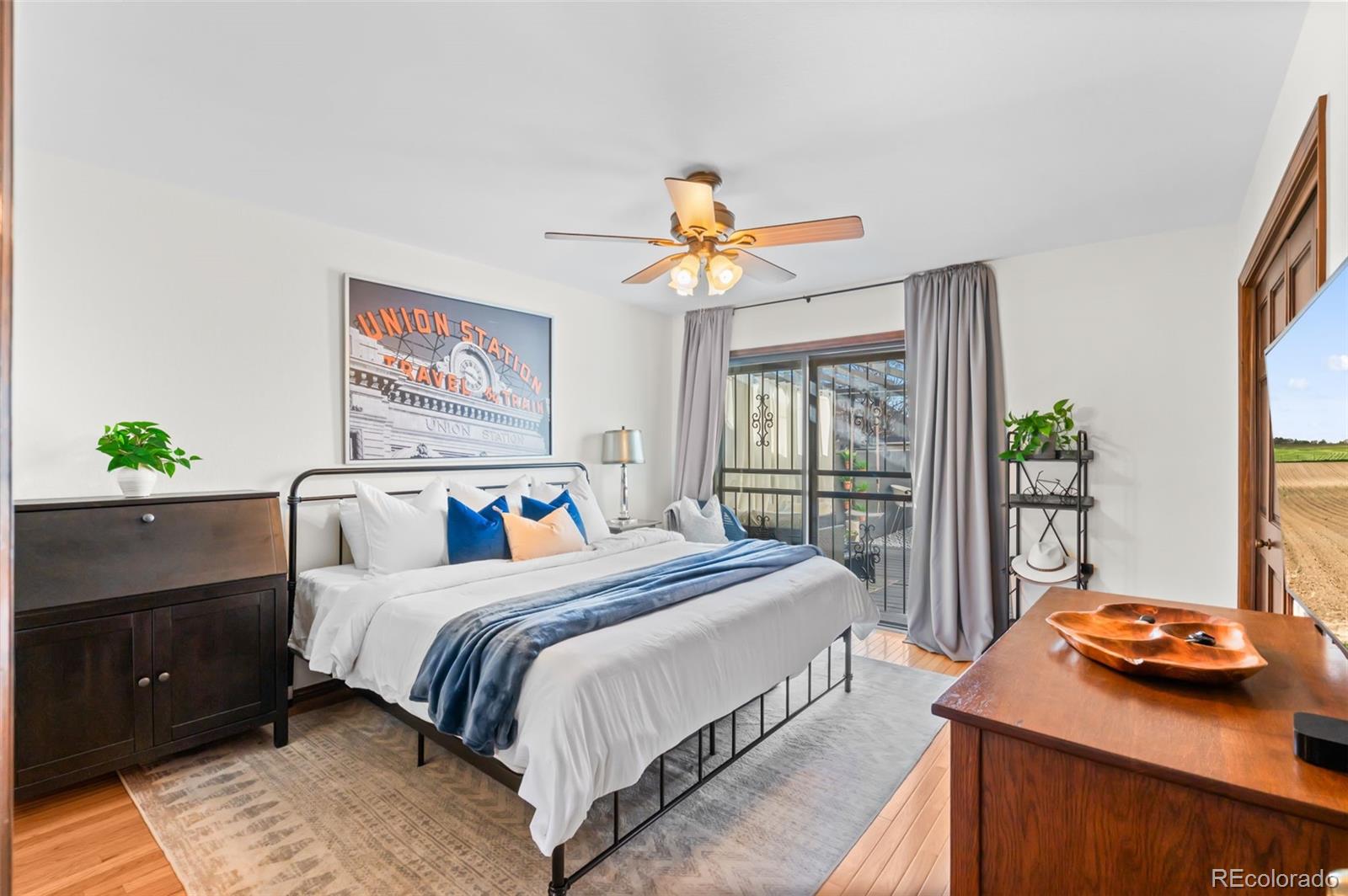 2325 Perry Street Denver, CO 80212 - Photo 12 of 39 a bedroom with a bed and a window