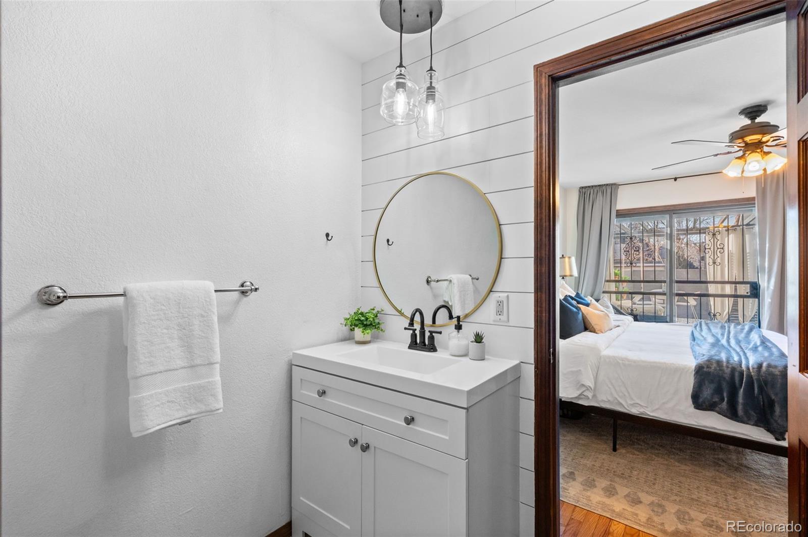 2325 Perry Street Denver, CO 80212 - Photo 15 of 39 a room with a bed and a mirror