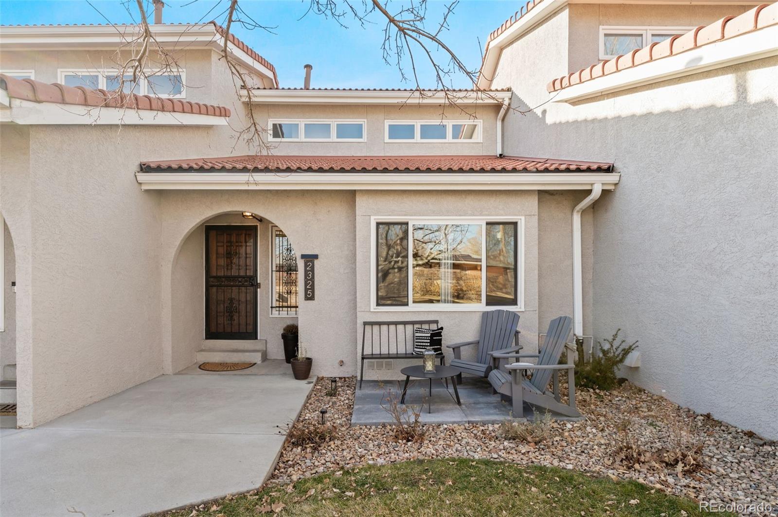 2325 Perry Street Denver, CO 80212 - Photo 2 of 39 a front view of a house with outdoor seating