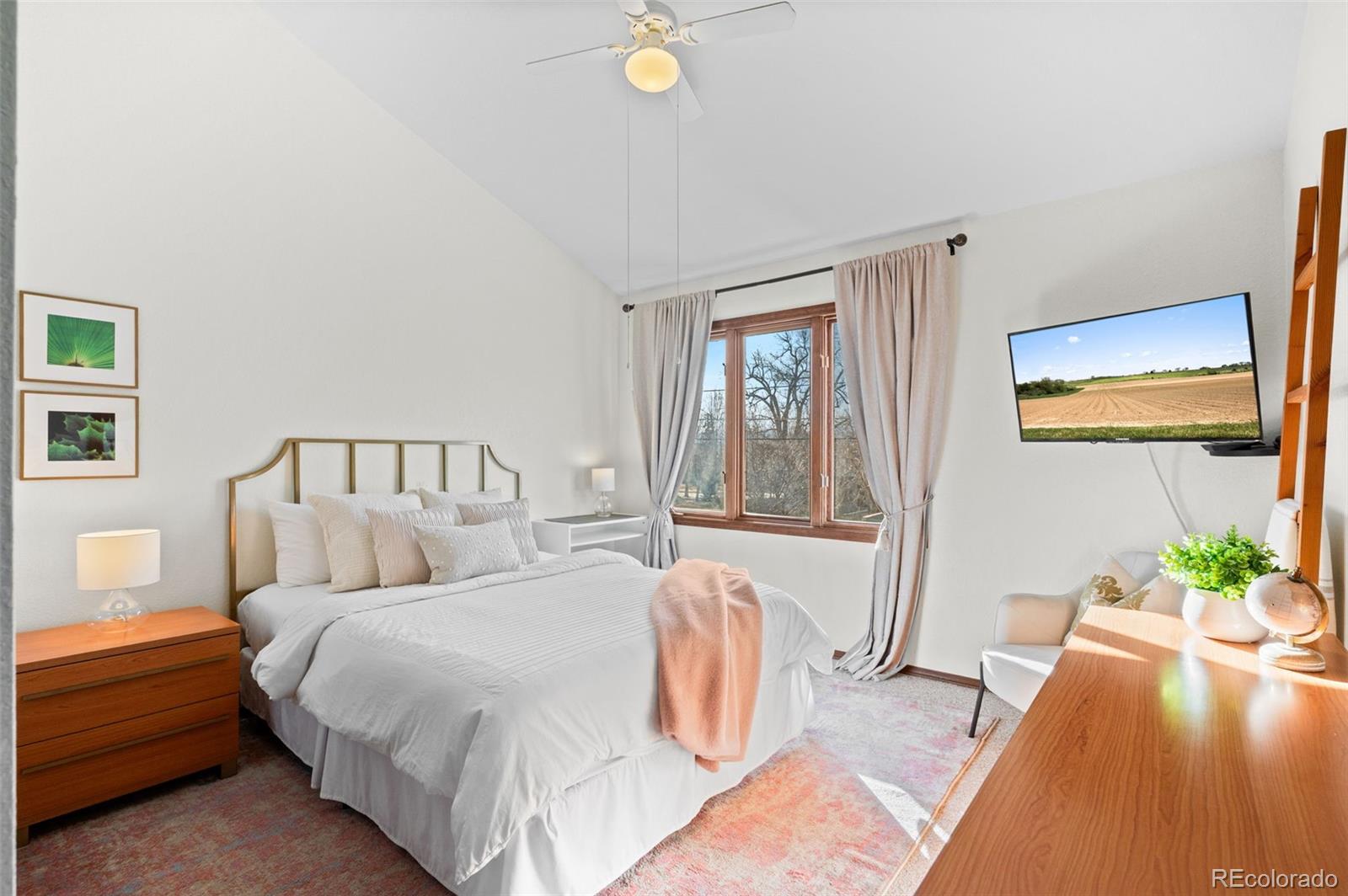 2325 Perry Street Denver, CO 80212 - Photo 23 of 39 a bed room with a bed and a potted plant