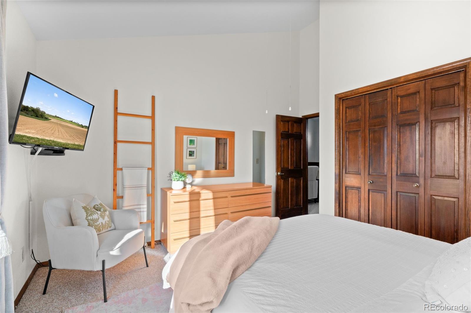 2325 Perry Street Denver, CO 80212 - Photo 24 of 39 a bedroom with a bed and a television