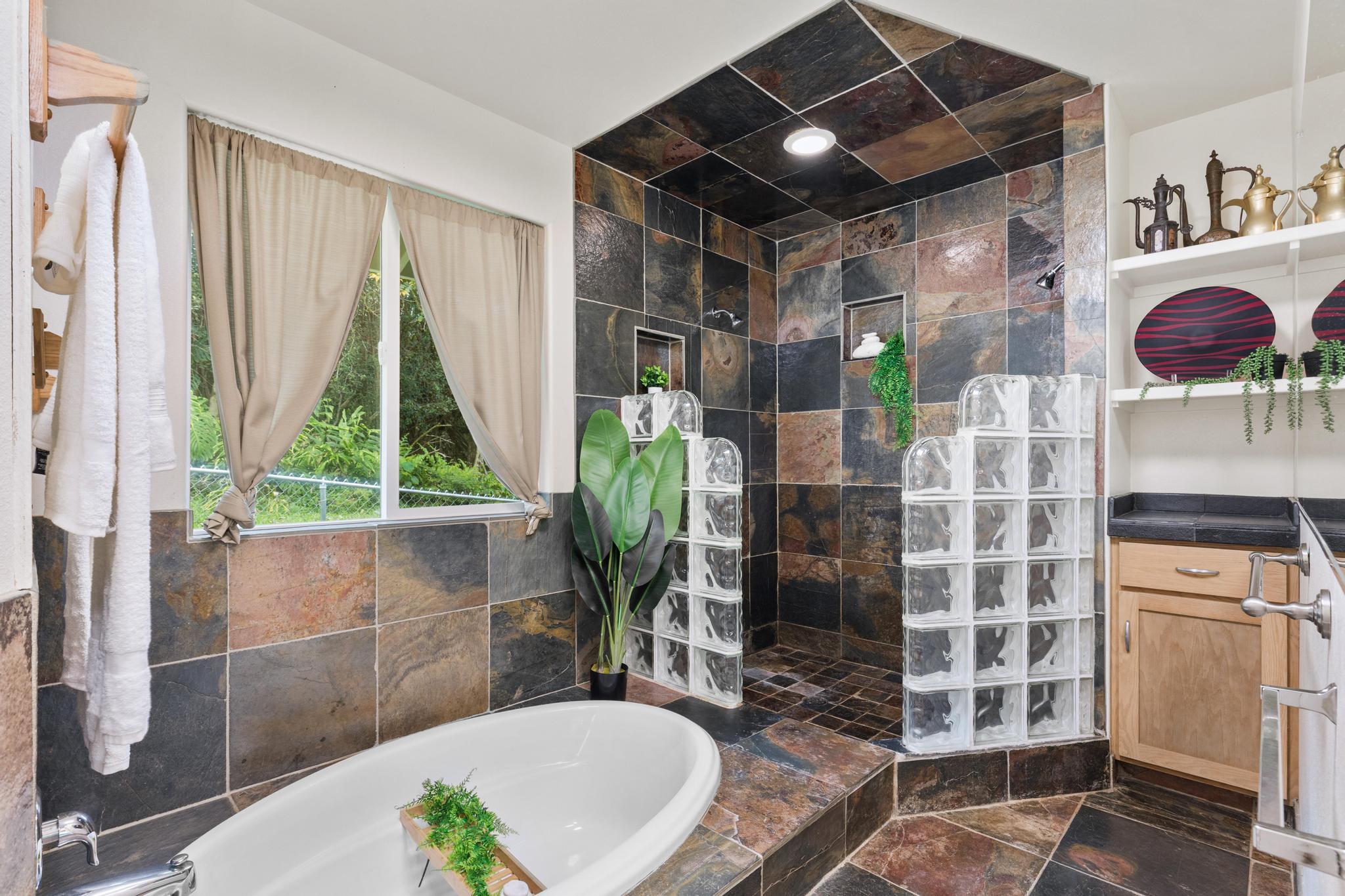 120 Opio Road Hilo, HI 96720 - Photo 12 of 30 a bathroom with a granite countertop shower a mirror and a sink