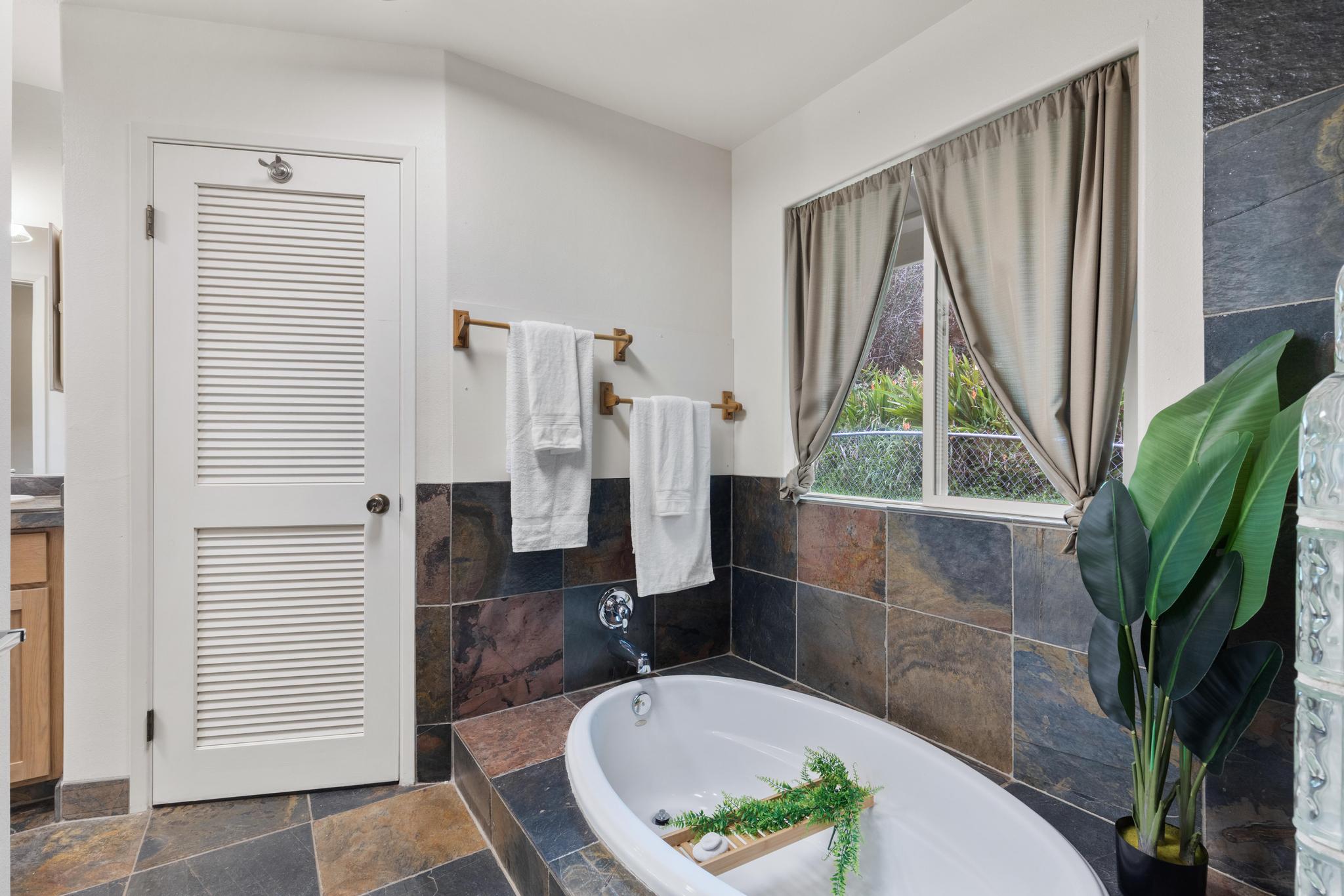 120 Opio Road Hilo, HI 96720 - Photo 13 of 30 a bathroom with a bathtub and a sink