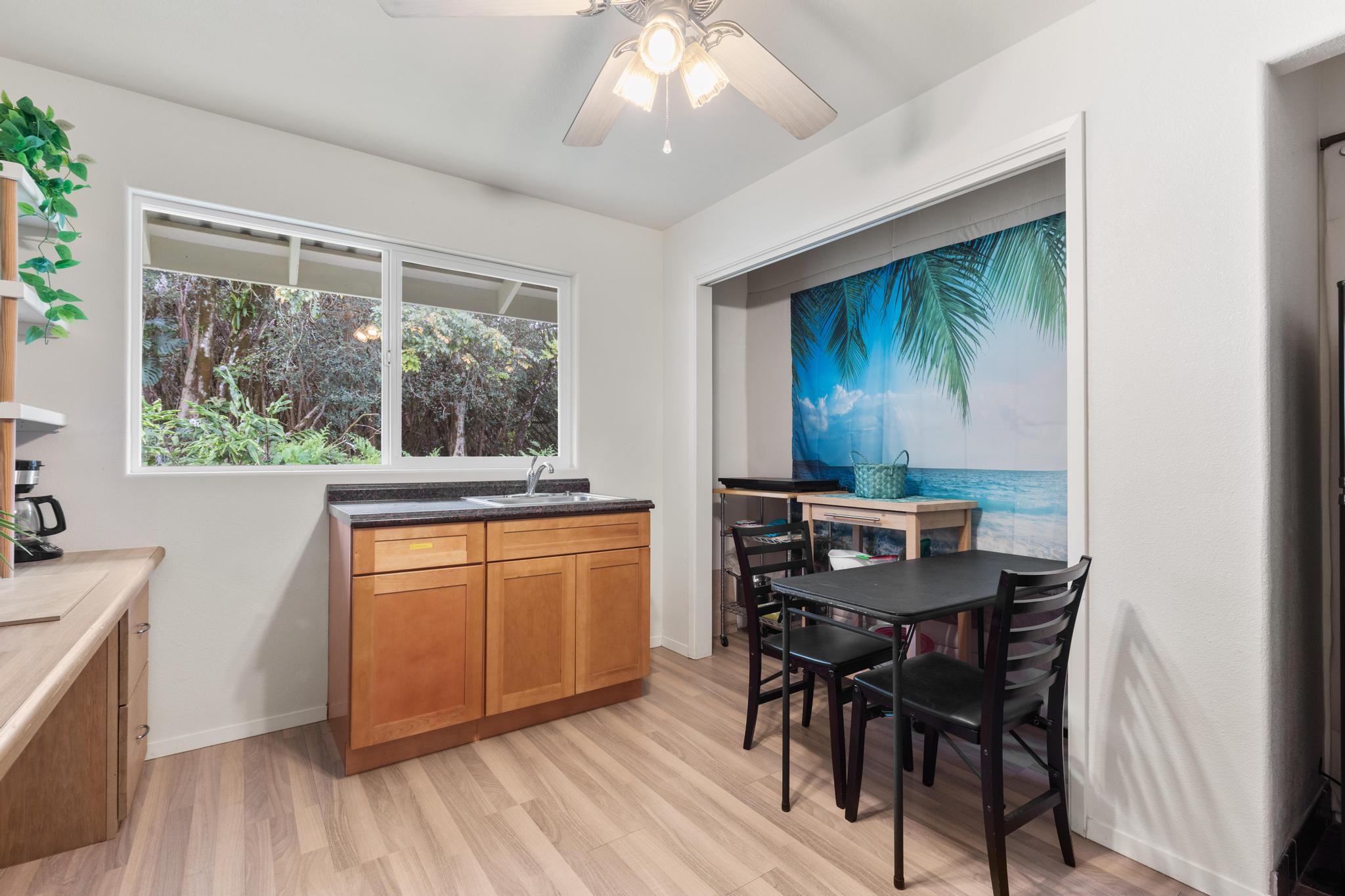 120 Opio Road Hilo, HI 96720 - Photo 16 of 30 a view of a dining room with furniture window and wooden floor