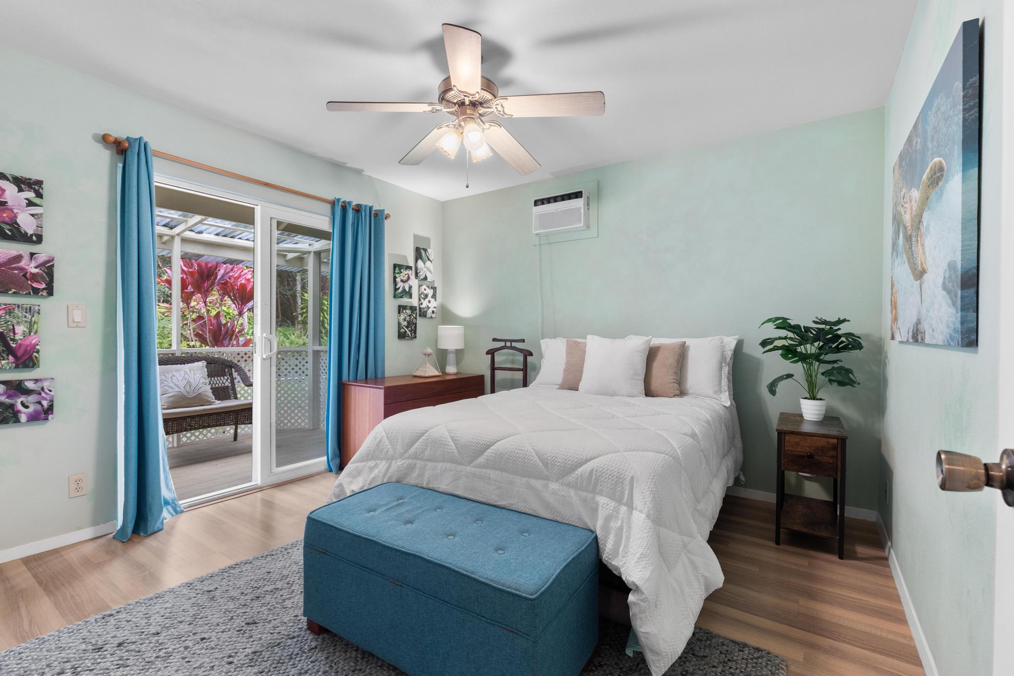 120 Opio Road Hilo, HI 96720 - Photo 17 of 30 a spacious bedroom with a bed dresser and a window