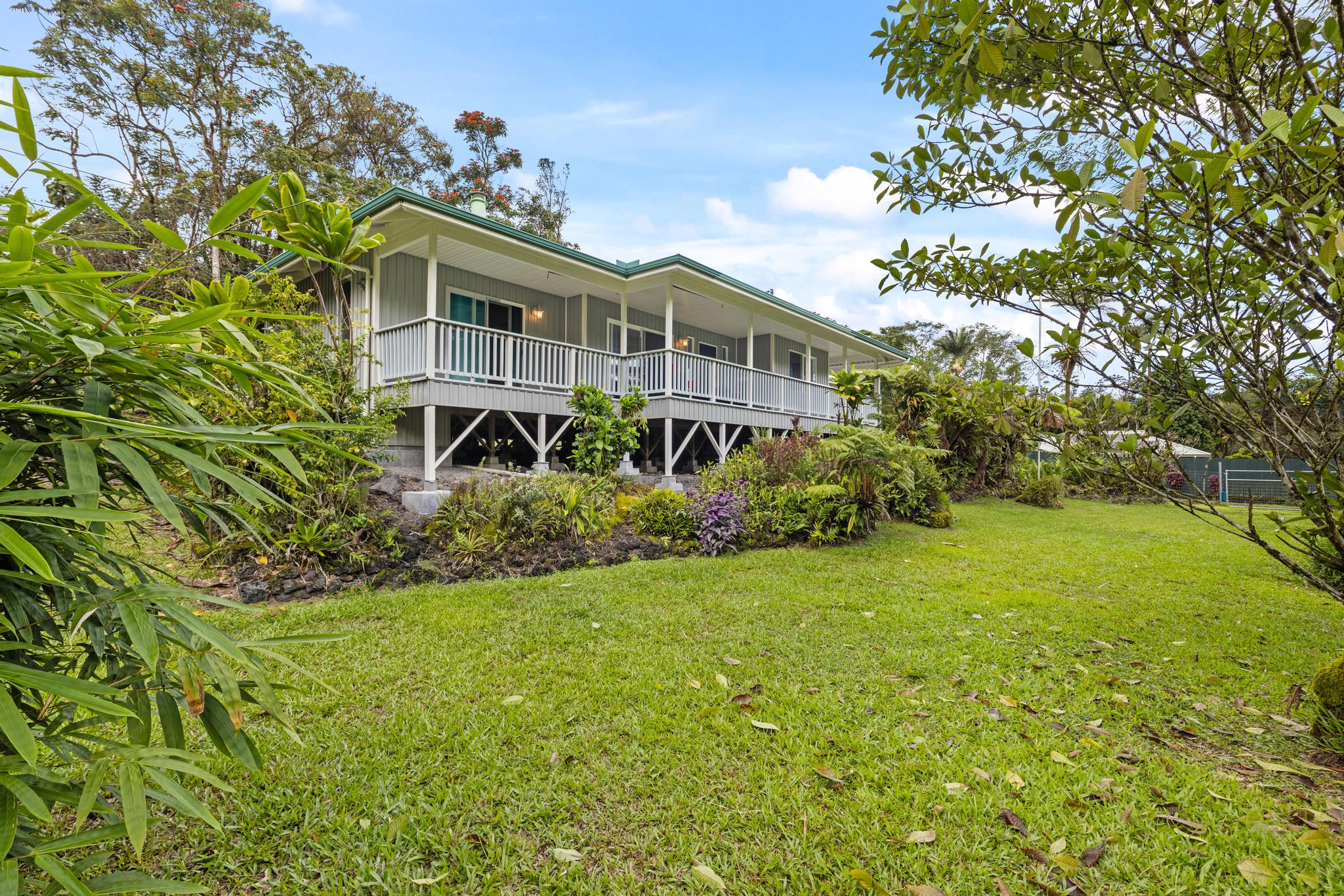 120 Opio Road Hilo, HI 96720 - Photo 25 of 30 a front view of a house with a garden