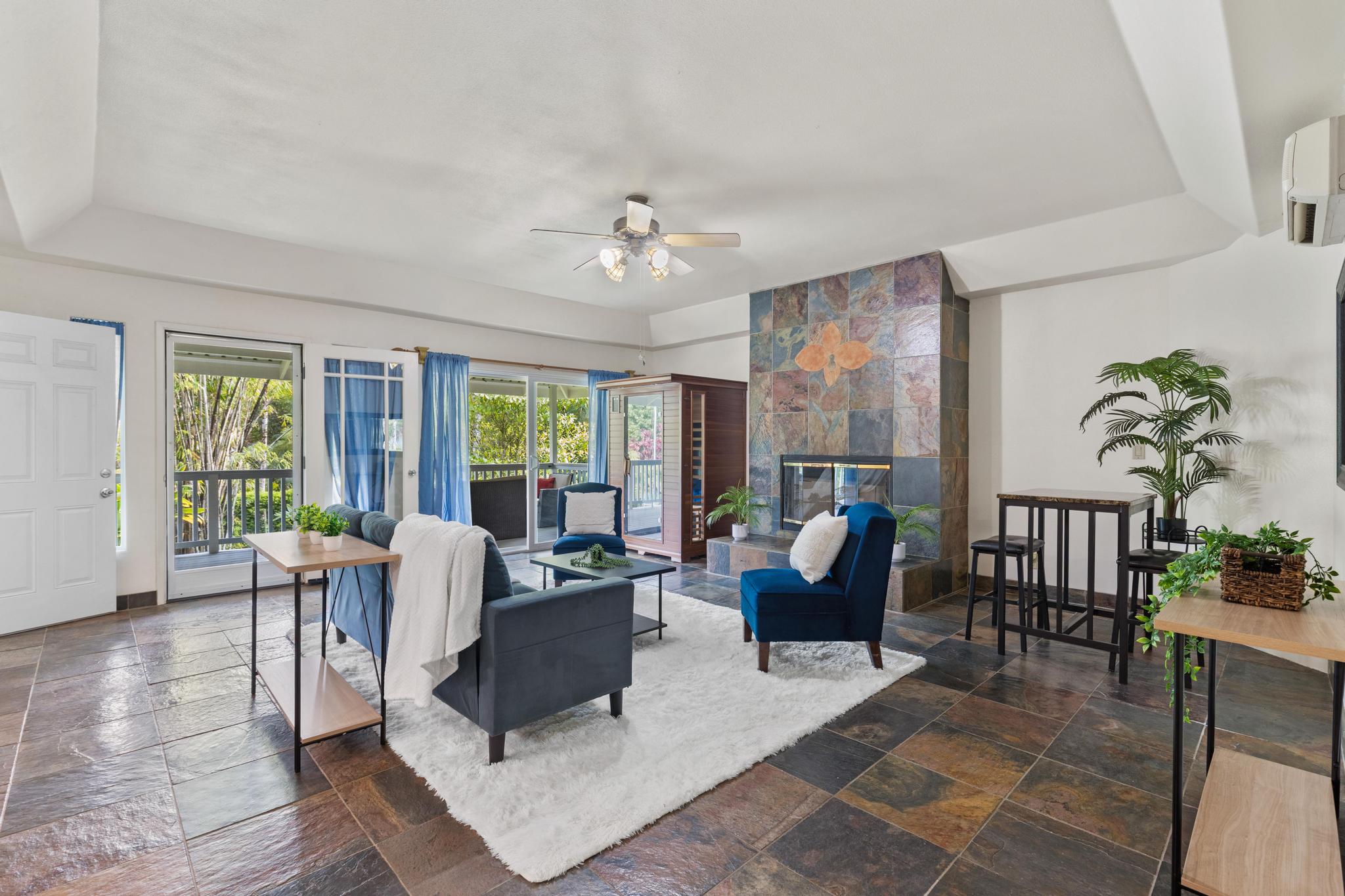 120 Opio Road Hilo, HI 96720 - Photo 4 of 30 a living room with furniture and floor to ceiling windows