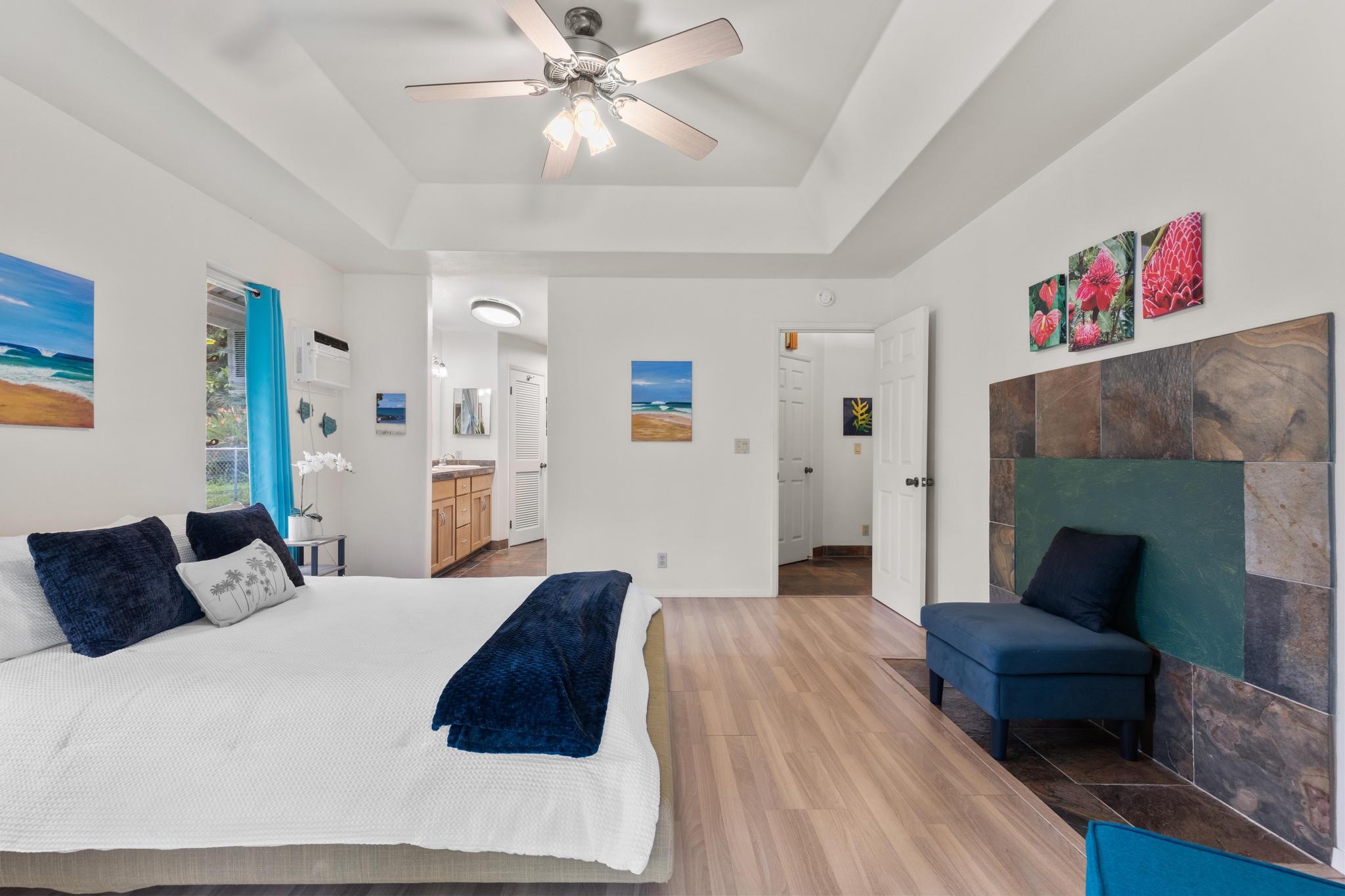 120 Opio Road Hilo, HI 96720 - Photo 9 of 30 a bedroom with a bed and a couch