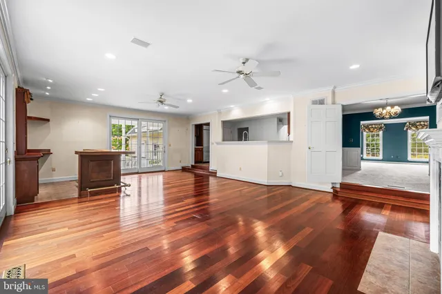 a kitchen with granite countertop sink stove and cabinets