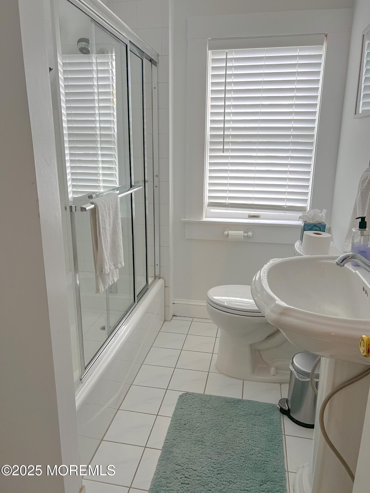 413 Morris Avenue Spring Lake, NJ 07762 - Photo 9 of 14 a bathroom with a sink a toilet and tub