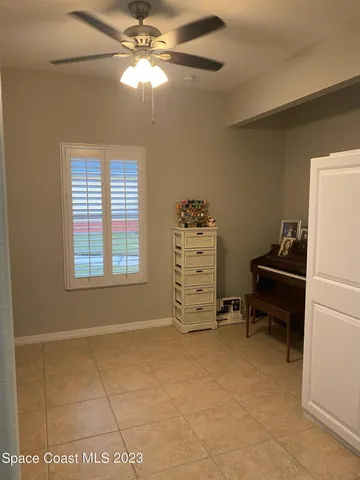 a view of workspace with furniture and a window